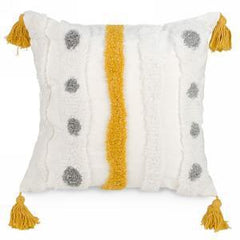 Tufted cushion with yellow tassels